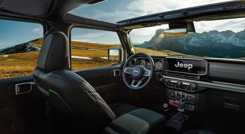 The interior of a 2024 Jeep Wrangler for sale at a Jeep dealer.