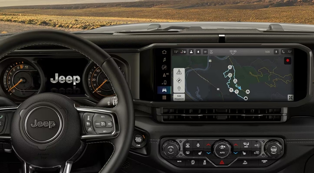 Directions on the infotainment screen in a 2025 Jeep Wrangler for sale.