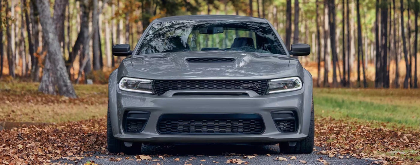 Head-on view of a grey 2023 Dodge Charger SRT at a Dodge dealer.