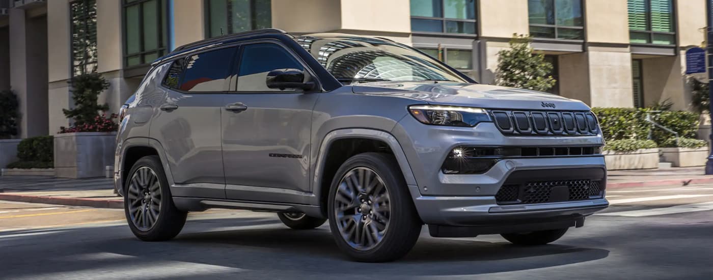 A grey 2022 Jeep Compass driving to a Jeep dealer near Kernersville.